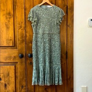 Mac Duggal hand beaded flounce sleeve dress.